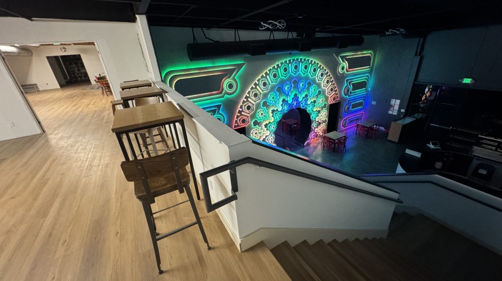 View of the Portal of Wonder in Cafe Dobe, from the top of the stairs with part of The Upstairs space visible.