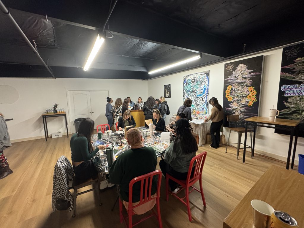 A group does a craft project at an event in The Upstairs space.