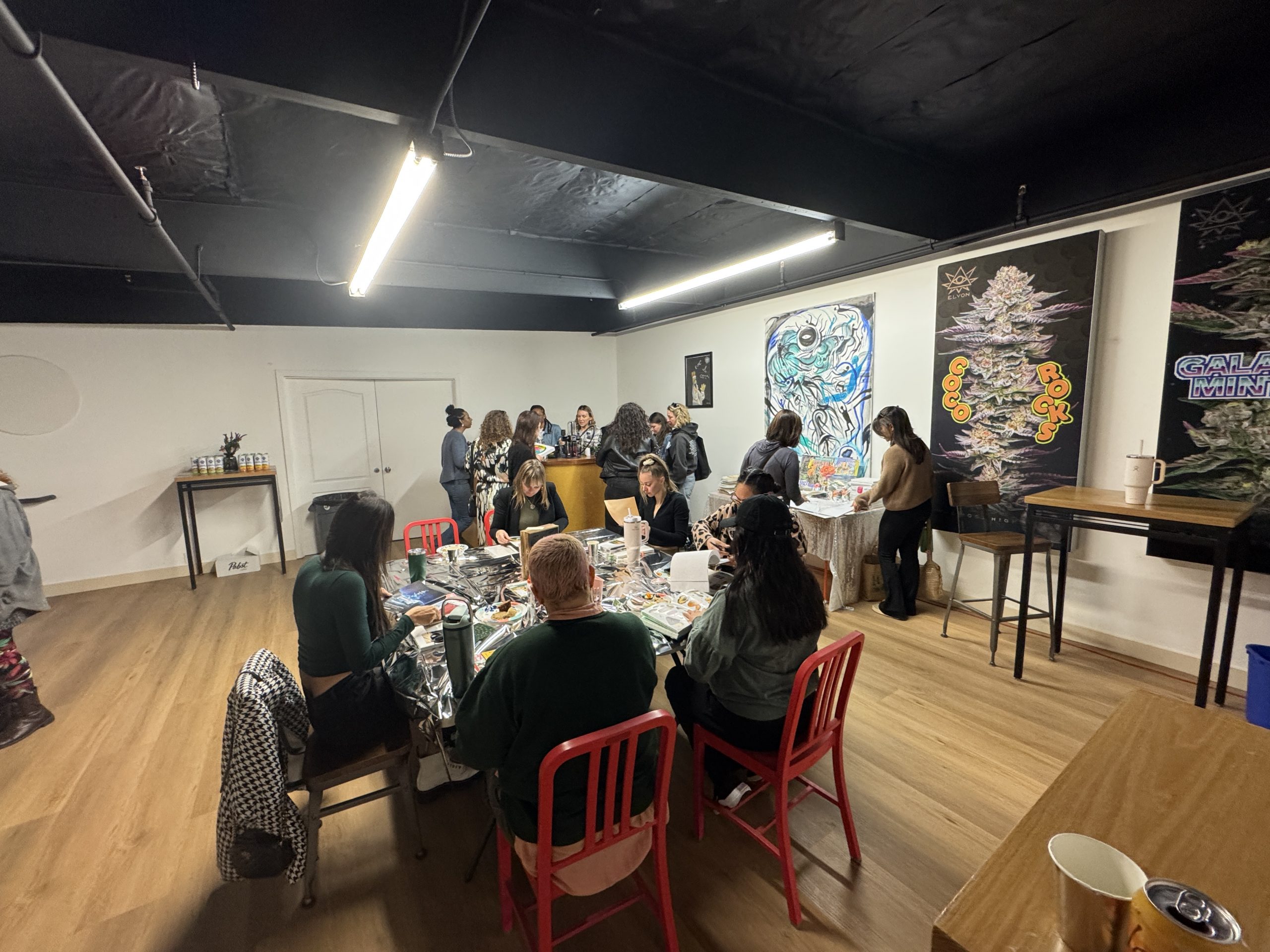 A group does a craft project at an event in The Upstairs space.